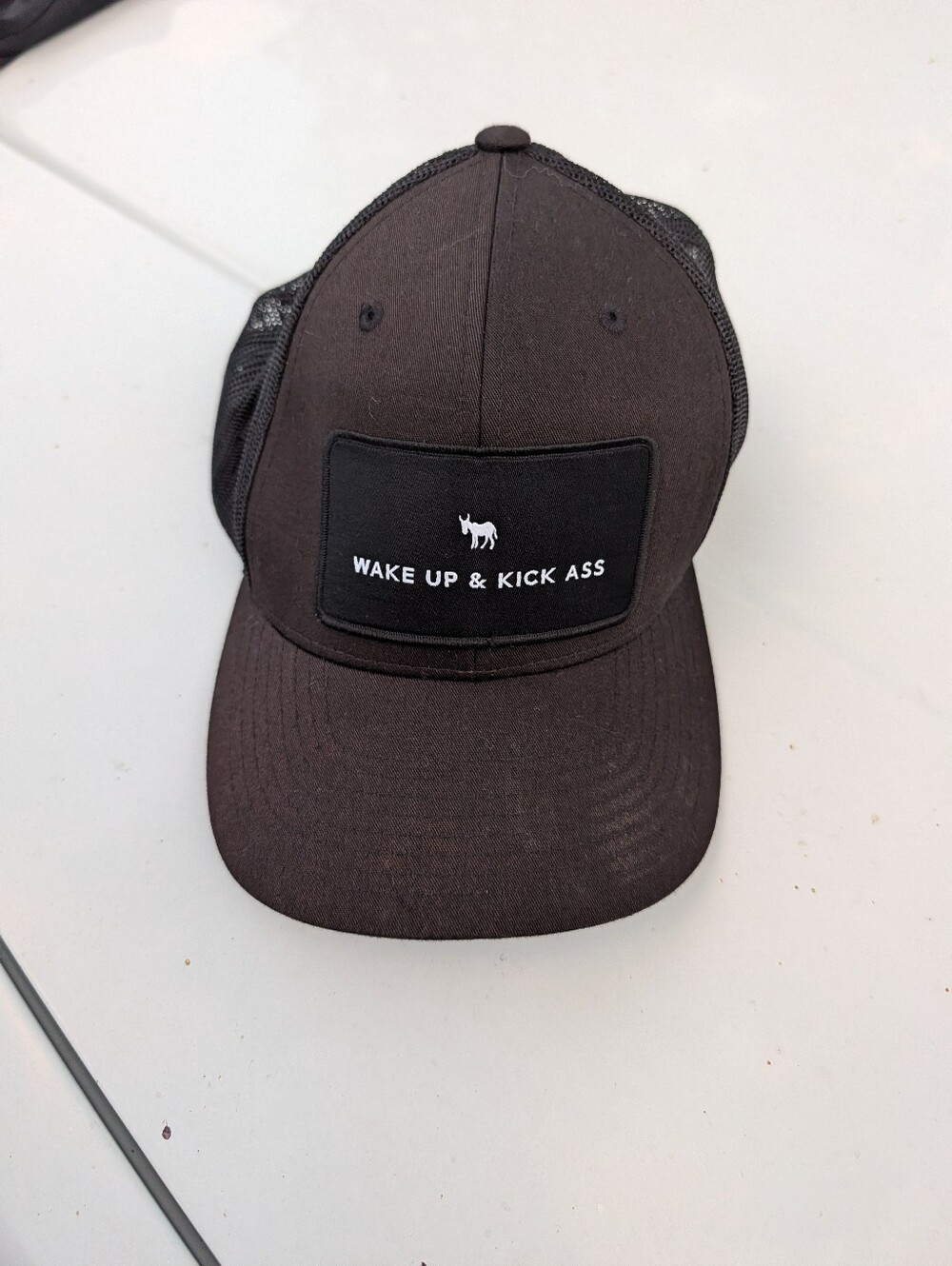 Black Trucker Hat with "Wake Up & Kick Ass" Patch